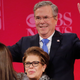 Jeb Bush throws up two peace signs after the CBS News Republican presidential debate in Greenville, S.C. on Feb. 13, 2016.
